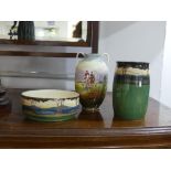 A Royal Doulton woodland scene Jar, the green ground with top band decorated in woodland scenes,