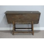 An antique oak Dough Bin, on a later stand, 48½in (123cm) long, 32in (81cm) high (including stand)