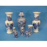 A pair of early 20thC Chinese Blue and White Vases, the body decorated with warriors, with a six