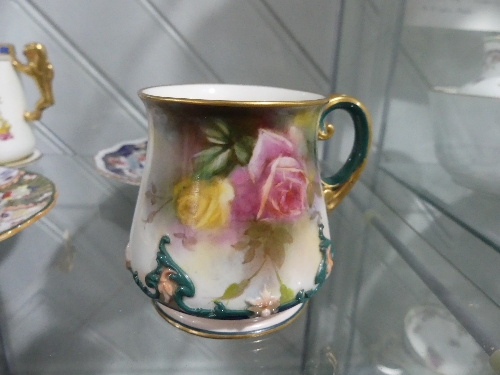 A Hadleys Worcester Mug, the floral painted body with foliate decoration in relief, together with