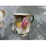 A Hadleys Worcester Mug, the floral painted body with foliate decoration in relief, together with
