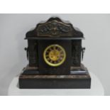 A large Victorian black slate Mantel Clock, with classical styling, with key, 19in (48.5cm) wide,