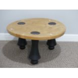 Contemporary design: a craftsman-made burr-maple circular Coffee Table, raised on three black