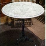 A Victorian style cast iron Garden Table, with circular white marble top, 29in (74cm) diameter x