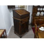 An early 20thC oak Clerk's Desk/Standing Rostrum, the top with spindle gallery, above hinged lid