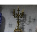 A gilt metal Candelabra, the four branches, each with wax effect light fittings, for electric use,
