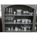 A large quantity of Crystal and Cut Glassware, comprising matched sets of Champagne Flutes, Wine
