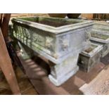 Garden statuary: a large reconstituted stone rectangular trough raised on supports, 37in long x 17½