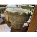 Garden statuary: a large, reconstituted stone Pot, formed with classical design patterns.