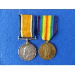 A W.W.1 pair of Medals, British War Medal and Victory Medal, awarded to 3093 Pte. W. E. Mc Ginnis.