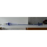 Two Victorian 'Bristol Blue' glass swords, with blue glass hilt and clear glass ribbed grip, the