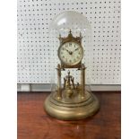 A brass Anniversary Clock, with painted enamel dial, and glass dome, 8in (20cm) diameter x 12½in (