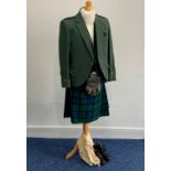 A mid 20thC Campbell Tartan Highlanders Scottish Piper's Outfit, comprising kilt, bottle green twill