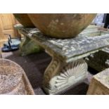 Garden statuary: a reconstituted stone rectangular Garden Seat, the supports formed with sunburst