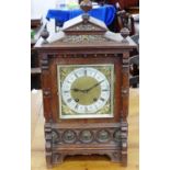 A late 19th century striking Bracket Clock, in architectural oak case with brass mounts, the 6in (