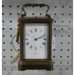 A early 20thC gilt brass Carriage Clock with repeat, of five-glass form with carry handle, the white