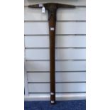 A Miner's Pick Axe from the Masonic Hall, Honiton, together with a Daily Mail Silver Bank Money