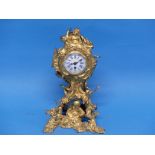 A Louis XV period Rococo style Chinoiserie Mantel Clock, the circular enamel dial with blue Roman
