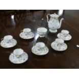 A Royal Stafford 'Violets-Pompadour' pattern part Coffee Service, comprising six Coffee Cups and