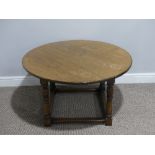 A Vintage oak circular Coffee Table, raised on turned legs, 36in (90cm) diameter x 20in (51cm) high,