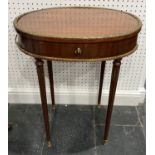 A French Louis XVI style oval Table, with brass onsets, single frieze drawer with Animals Head