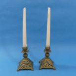 A pair of brass Christopher Dresser-style Candlesticks, with pierced foliate decoration, 5¼in (13.