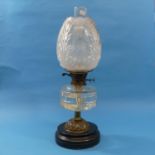 A late Victorian brass and glass Oil Lamp, with clear glass reservoir and frosted glass shade,
