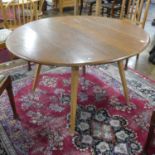 A mid 20thC elm Ercol Drop-flap Table, 48in (122cm) x 46in (117cm) x 28in (71cm) high (extended)