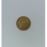 An Edwardian gold half Sovereign, dated 1904.