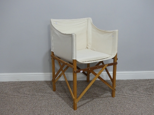 Contemporary design: a folding canvas 'Directors'  chair, together with a tall beech kitchen