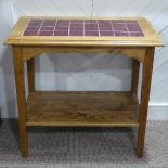 An early 20thC oak Tile-topped Side Table, with undertier, 30½in (78cm) wide x 18¼in (47cm) deep x