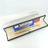 A vintage Parker gold plated Fountain Pen, with French instruction sheet, two cartridges and case,