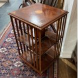 An Edwardian walnut revolving Bookcase, the top with inlays, 19in (48cm) wide x 19in deep (48cm) x