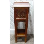 An Arts and Crafts mahogany carved Torchere / Plant Stand, with carved foliate motif and