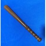 An antique Truncheon, with turned handle, 15in (38cm) long.