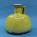A Brynxz Studio Pottery Flagon, in a green glaze, with impressed marks to base, 7in (18cm) high