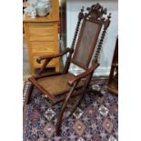 An antique mahogany Folding Chair, with barley twist supports and rush seating, 24in (61cm) wide x