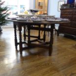 A 17thC Style oak Gateleg oval Dining Table, raised on turned legs, 53in (135cm) wide x 68in (172cm)