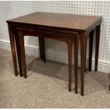 A vintage hardwood Nest of three Tables, with cross banded tops, the largest: 25in (63cm) wide x