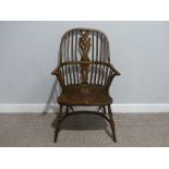 A 19thC style ash and elm Windsor-back Chair, raised on crinoline stretcher, 25in (63cm) wide x 18in