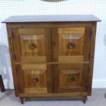 A 20th century walnut paneled Cupboard, the four doors enclosing vacant interior, circa 1970s,