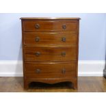 A Victorian mahogany Chest of Drawers, of small size, with four long graduated drawers, raised on