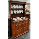 A 17thC Style oak Dresser, with plate rack upon drawers and doors, 43in (110cm) wide x 20in (51cm)