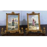 A pair of 19thC continental Girandole brass framed Porcelain panels, each painted to depict a
