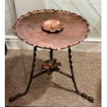 An Arts and Crafts Copper Table, the centre with stylised floral motif, raised on wrought legs and