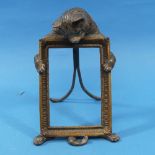 A late 19th/early 20thC Austrian cold painted bronze Picture Frame, modelled as a cat holding a