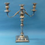 A silver plated three light Candelabra, the scroll arms detachable to leave a single central