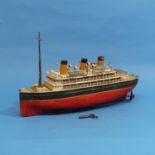 A Bing Tinplate clockwork ocean liner c.1920's, twin screw, marked Bing on top.  Hull painted red