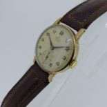 A vintage Smiths Deluxe 9ct gold gentleman's Wristwatch, with 15-jewels movement, the circular