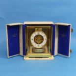A Jaeger Le Coultre Atmos Clock, the 10.75cm white chapter ring with Arabic numerals enclosing an